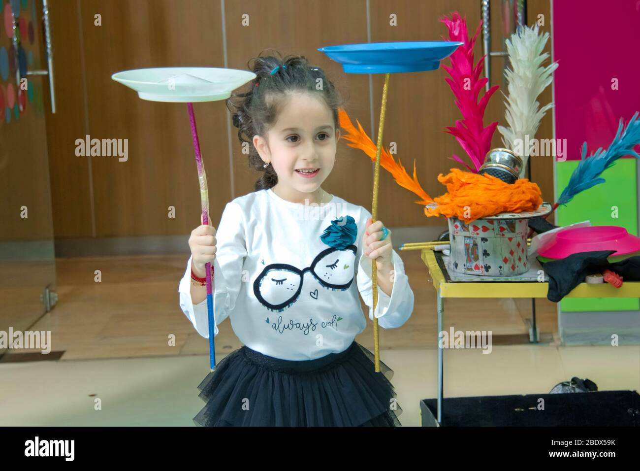 Fun with Spinning Plates .balancing a spinning plate. Kids learning how to play spinning plate
