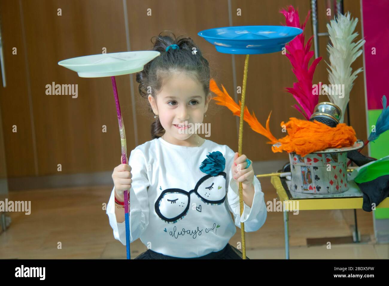 Fun with Spinning Plates .balancing a spinning plate. Kids learning how