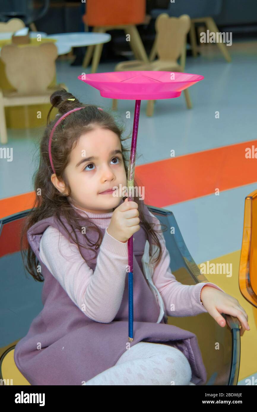 Fun with Spinning Plates .balancing a spinning plate. Kids learning how to play spinning plate