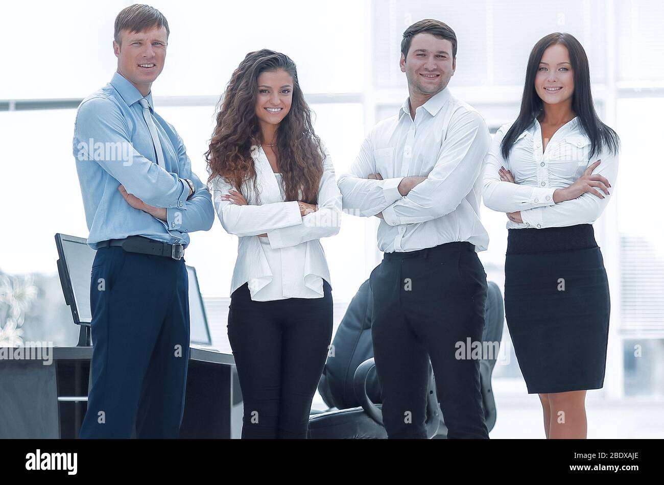 successful business team standing near the desktop Stock Photo - Alamy