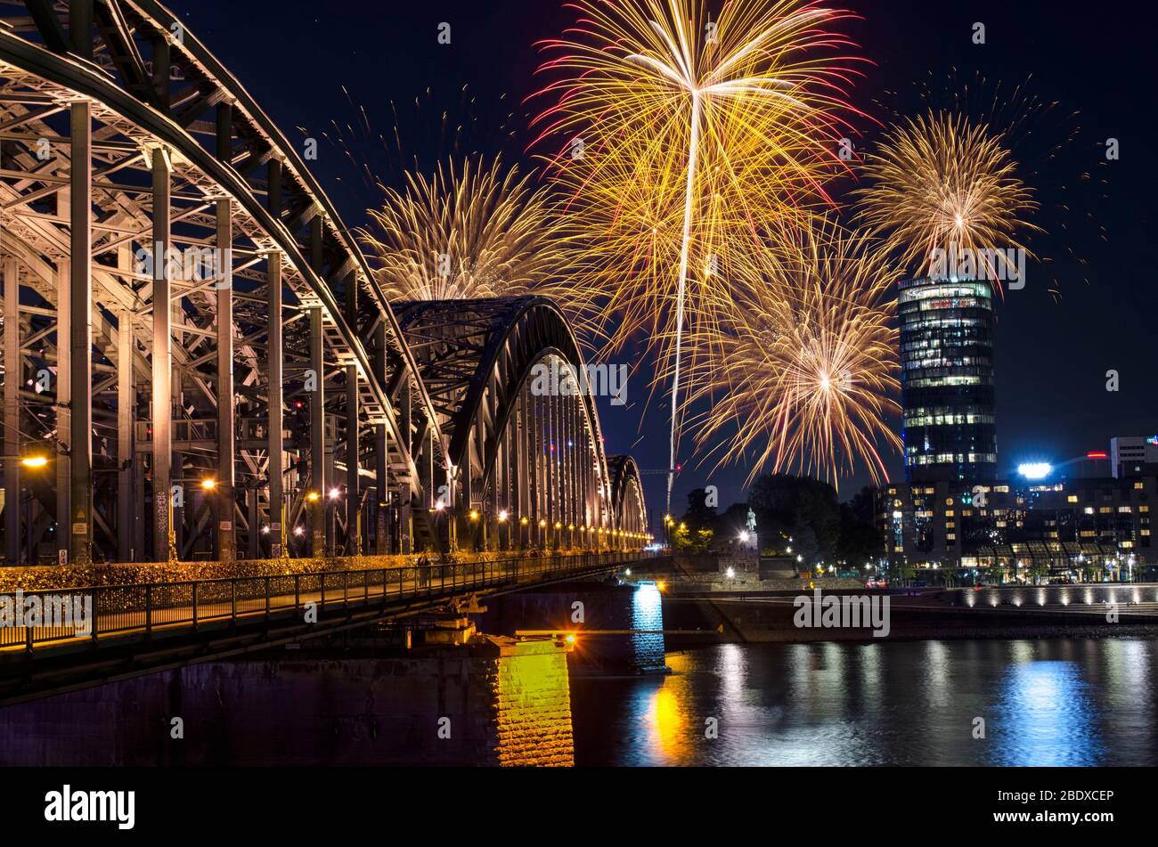 Celebration Fireworks Over City at Night Stock Photo