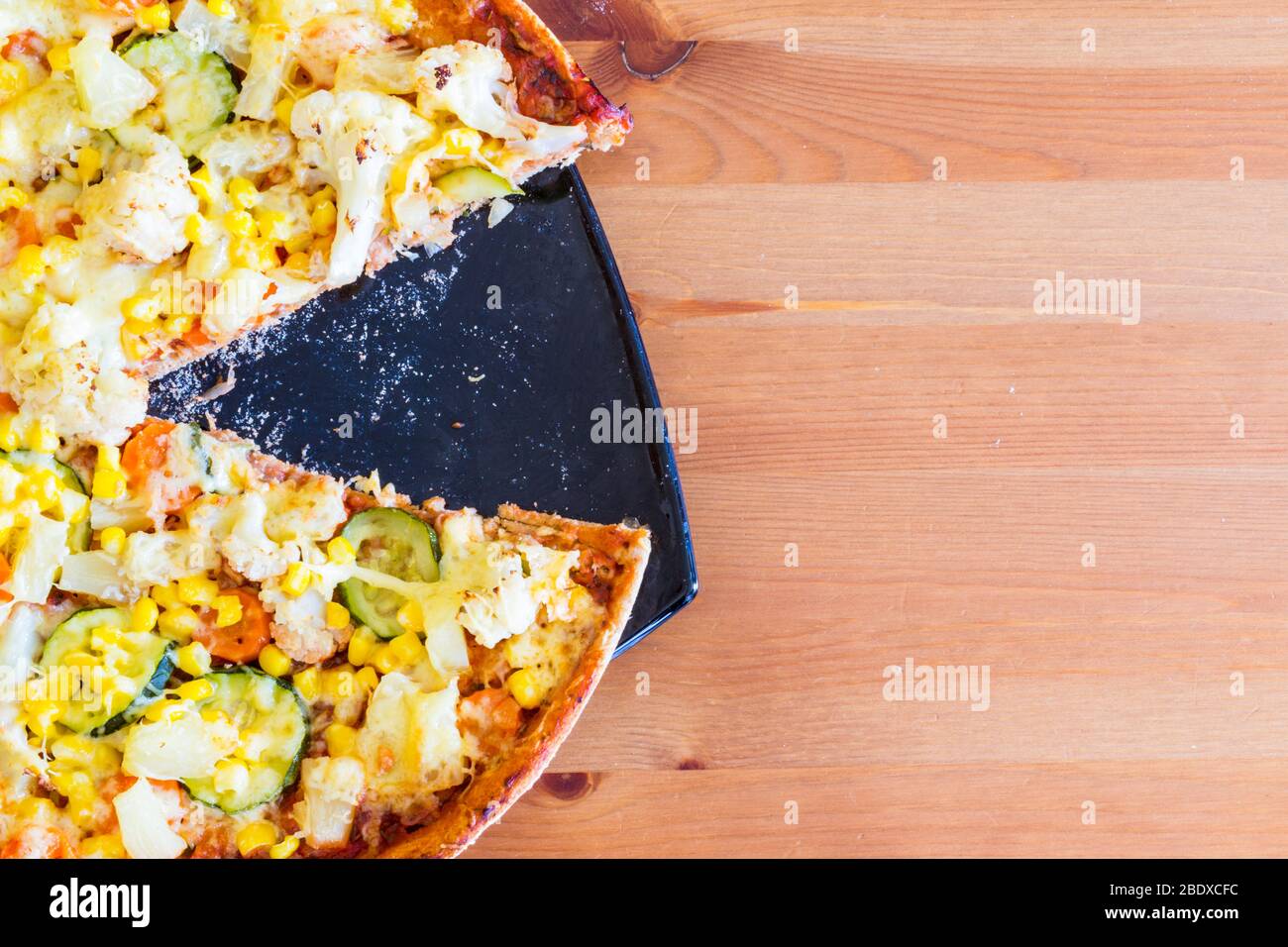 Close Up Of Homemade Vegetarian Veggie Pizza With Cheese Pineapple Corn Vegetables Zucchini Cauliflower On Wooden Table Stock Photo Alamy