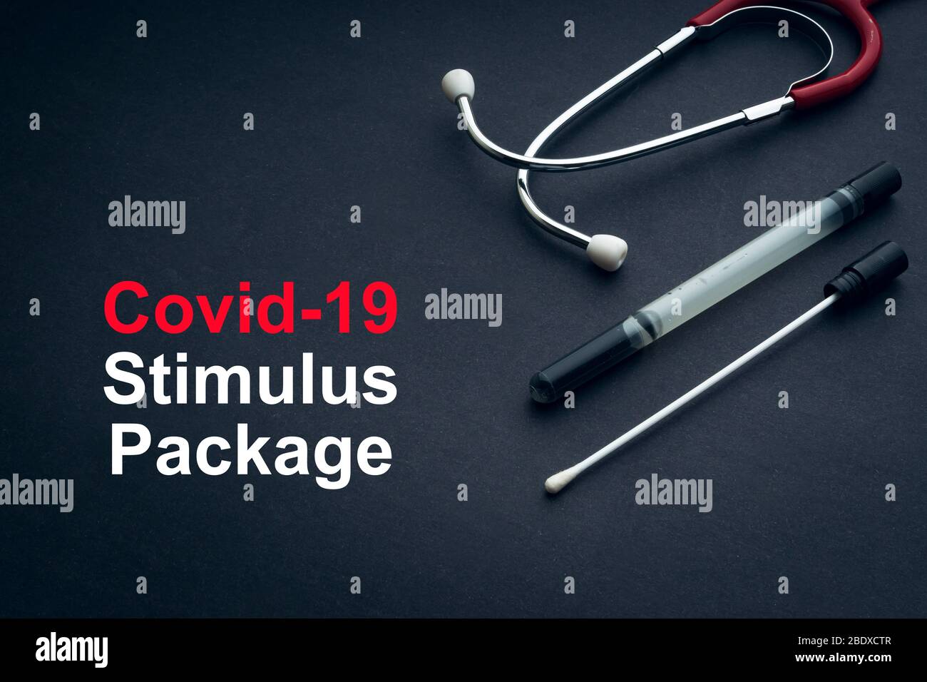 COVID-19 or CORONAVIRUS STIMULUS PACKAGE text with stethoscope and medical swab on black background. Covid-19 or Coronavirus concept. Stock Photo