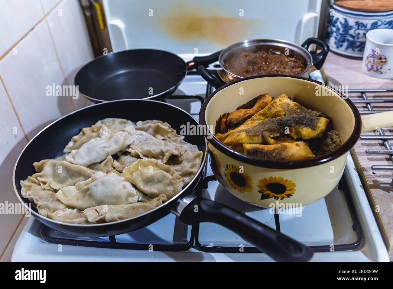 Cooking of traditional Polish Christmas dishes dumplings, bigos and carp fish Stock Photo Alamy