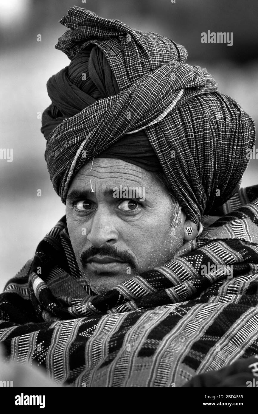 The image of Rajasthani man portrait at Pushkar animal Fair, Ajmer, Rajasthan, India, asia Stock Photo