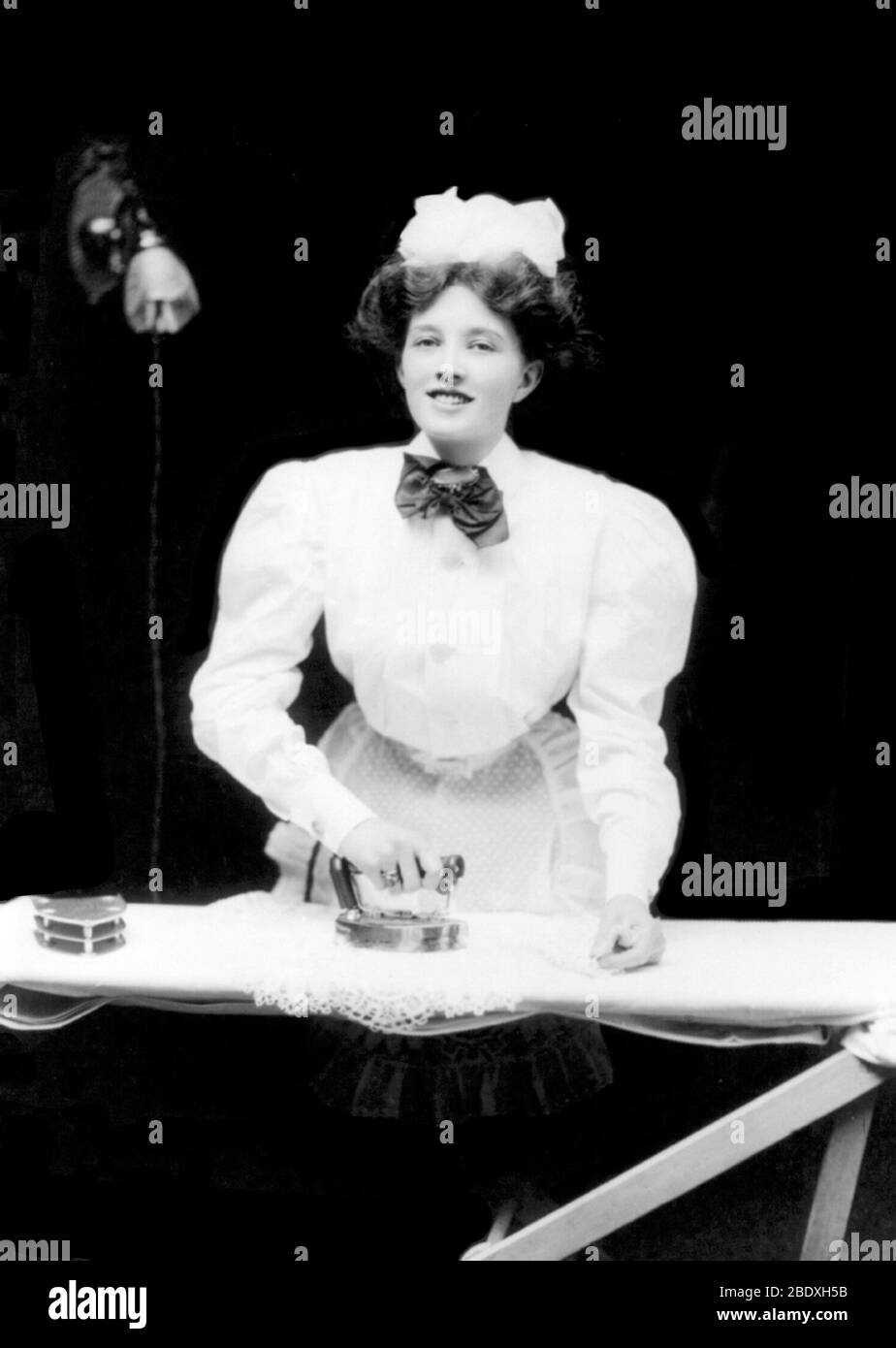 Housemaid Ironing, 1908 Stock Photo