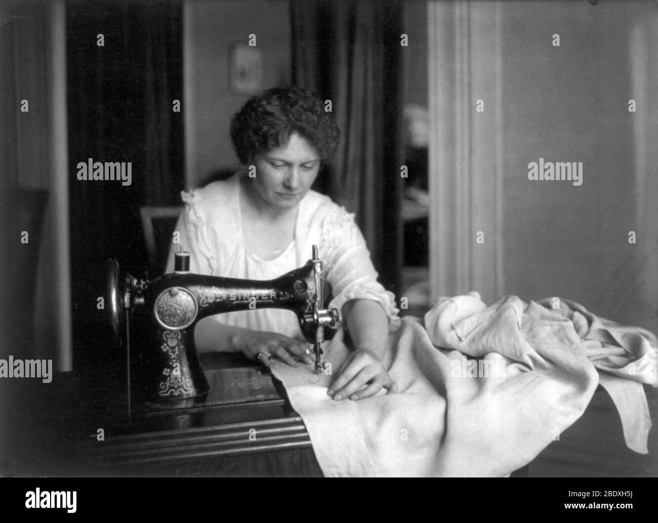 Housewife Using Sewing Machine, 20th Century Stock Photo Alamy