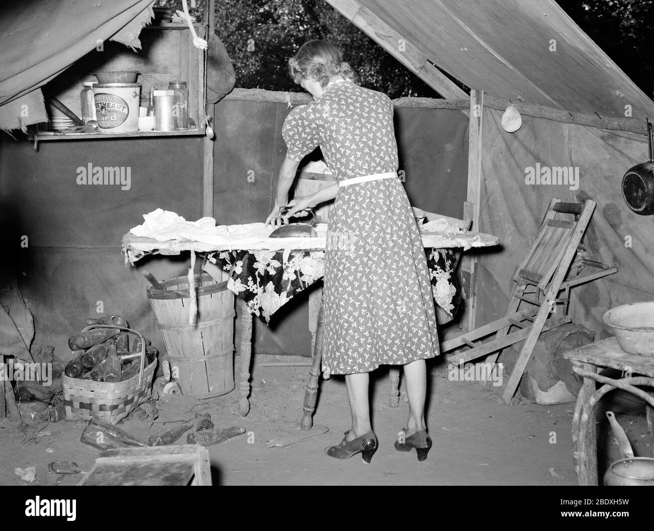 Ironing clothes Black and White Stock Photos & Images - Alamy
