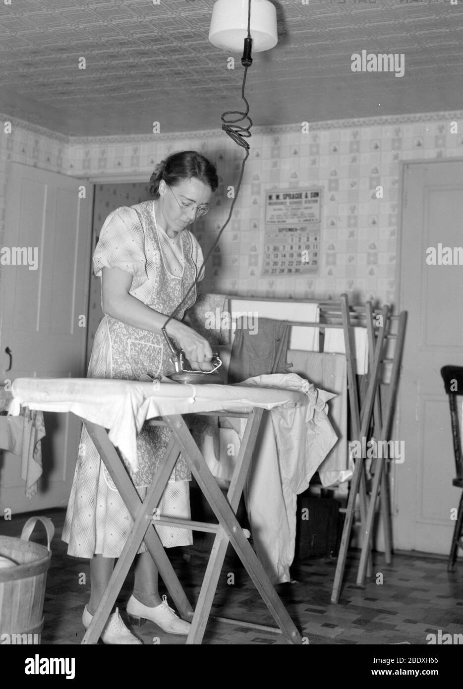 Housemaid Ironing, 1937 Stock Photo