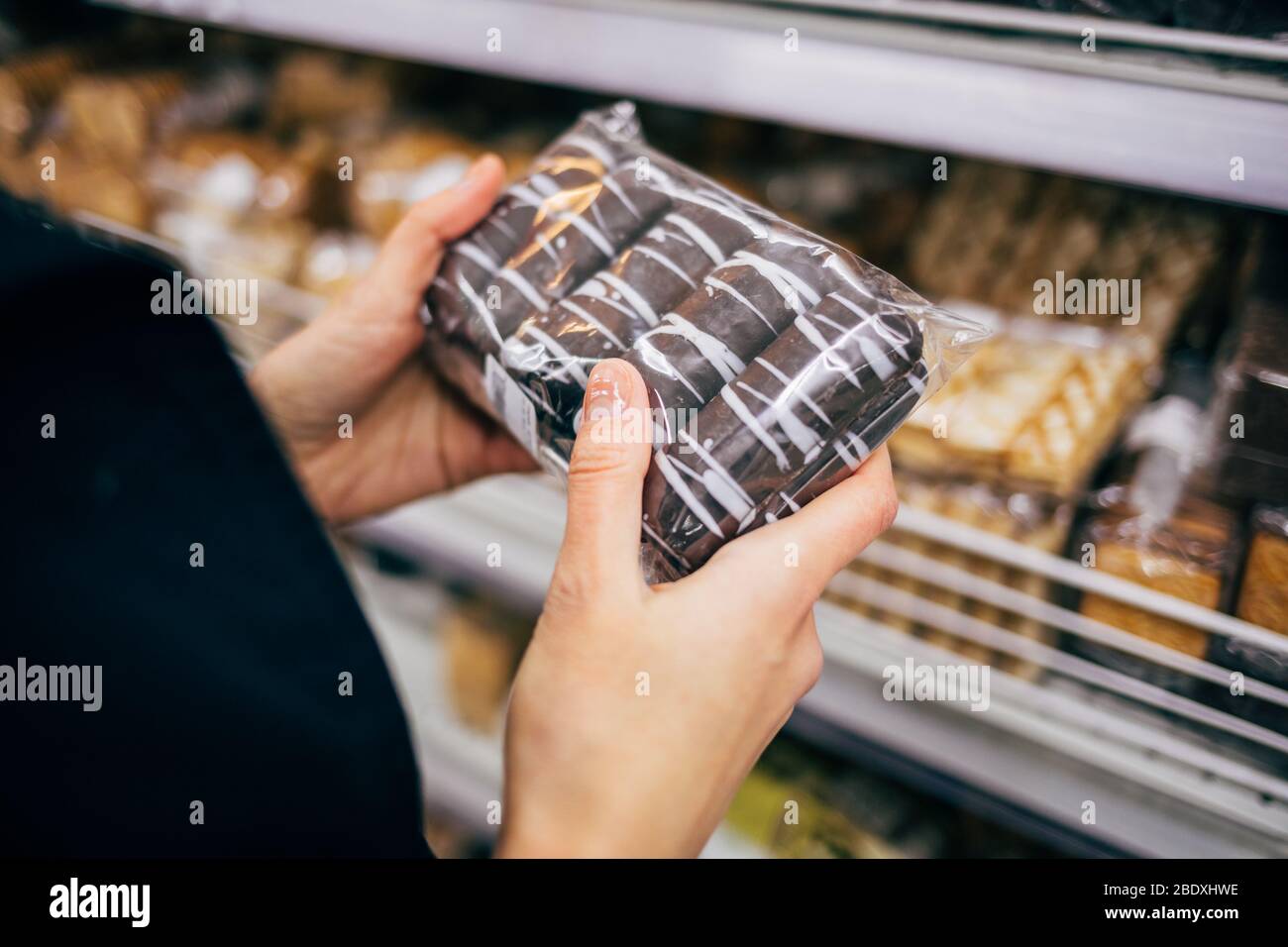 Hand holding bag of sweets hi-res stock photography and images - Alamy