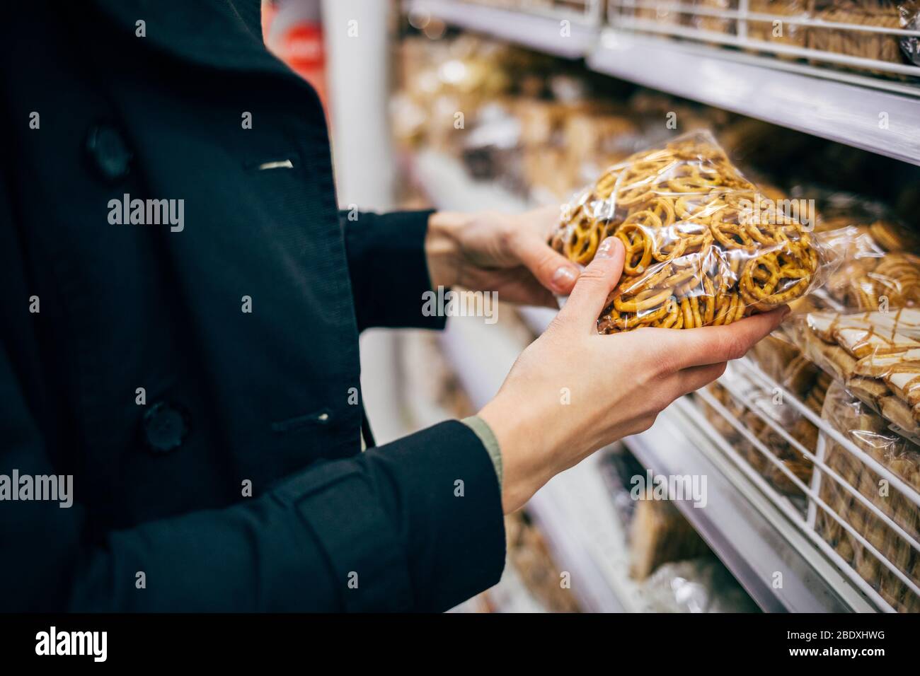 Hand holding bag of sweets hi-res stock photography and images - Alamy