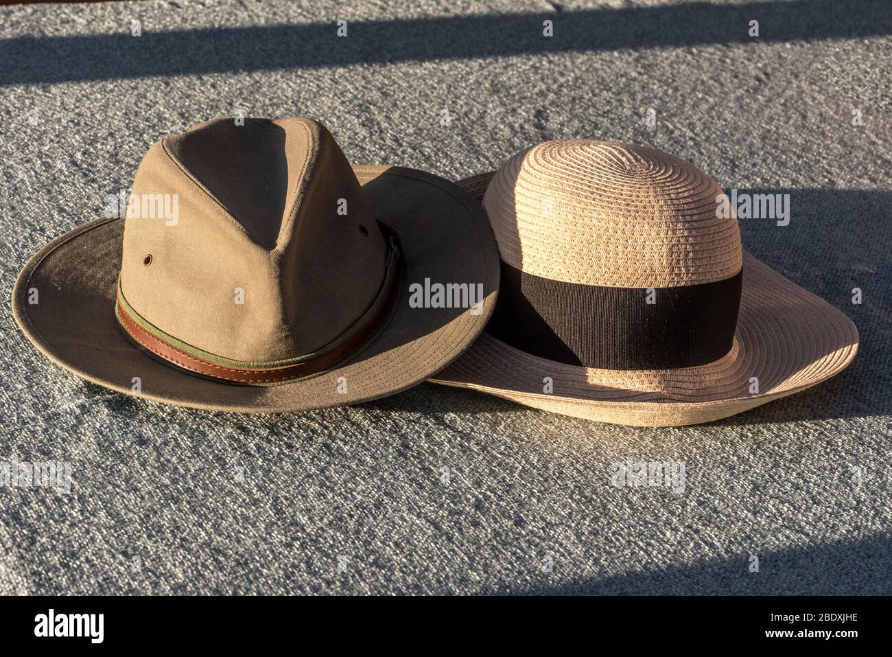 Togetherness. Couple of sun hats. Stock Photo
