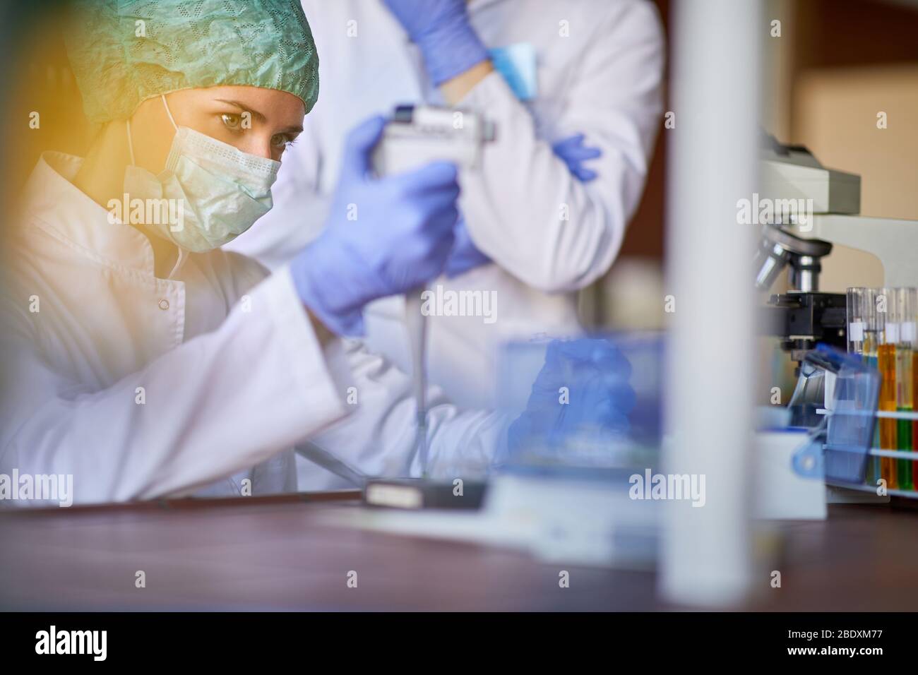 Lab worker with protecting gear working in lab Stock Photo Alamy