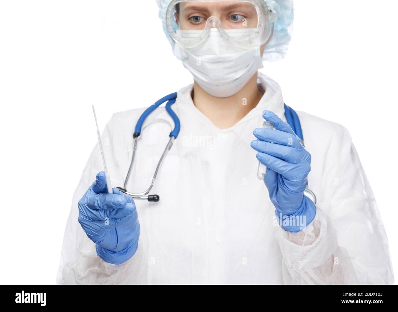 Close-up shot of doctor wearing protective suit, goggles and surgical mask ready to take saliva test sample  performing Saliva testing (Salivaomics) d Stock Photo