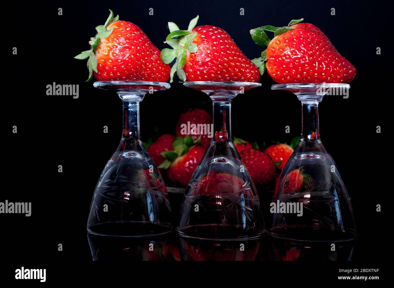 close-up of strawberrys on little decorated glasses on a dark background Stock Photo