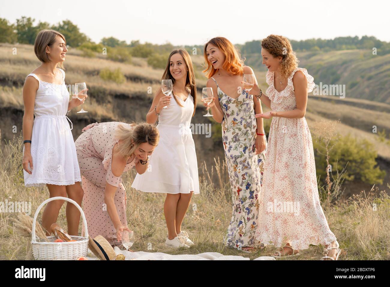 The company of gorgeous female friends having fun and enjoys a summer ...