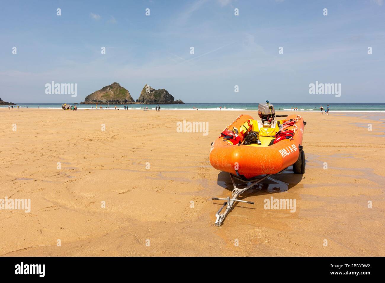 RNLI Dinghy / Inflatable safety boat on Holywell Beach, Howlywell, north Cornwall, UK. Stock Photo
