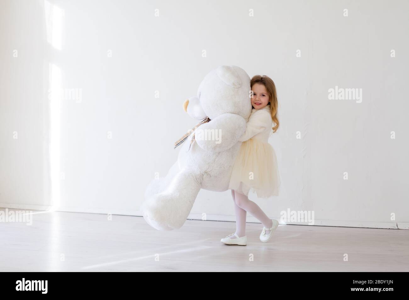 girl with giant teddy bear