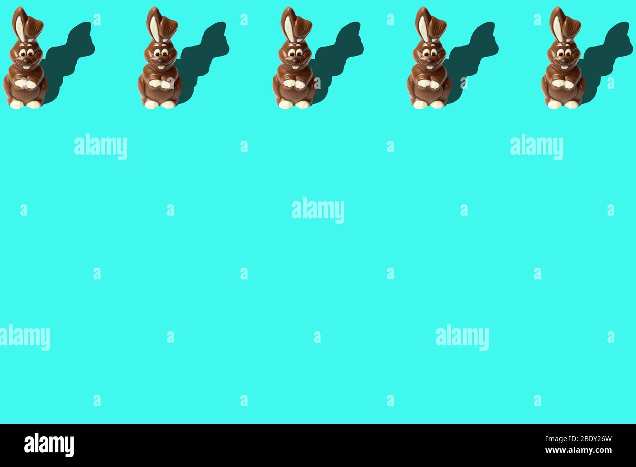 Chocolate Easter rabbit on light blue background with copyspace Stock ...