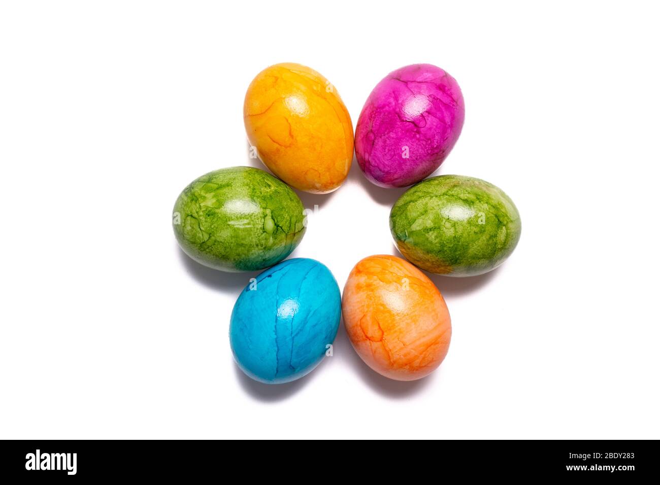 Several easter eggs in different colors isolated on white background Stock Photo