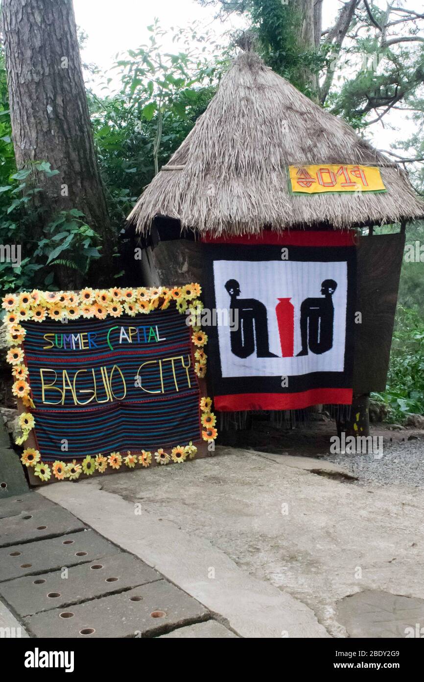 June 5, 2019-Baguio City Philippines : a wooden small house with a weaved costure and letterings the reads: 'summer capital, Baguio City'. Wright park Stock Photo