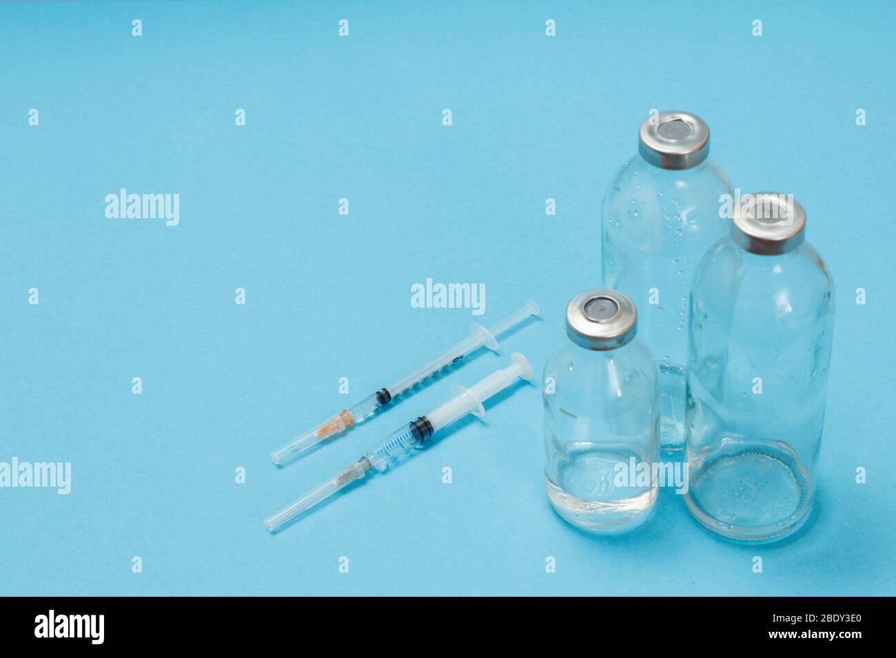 Glass bottles for liquid medicine and plastic syringes for injection on ...