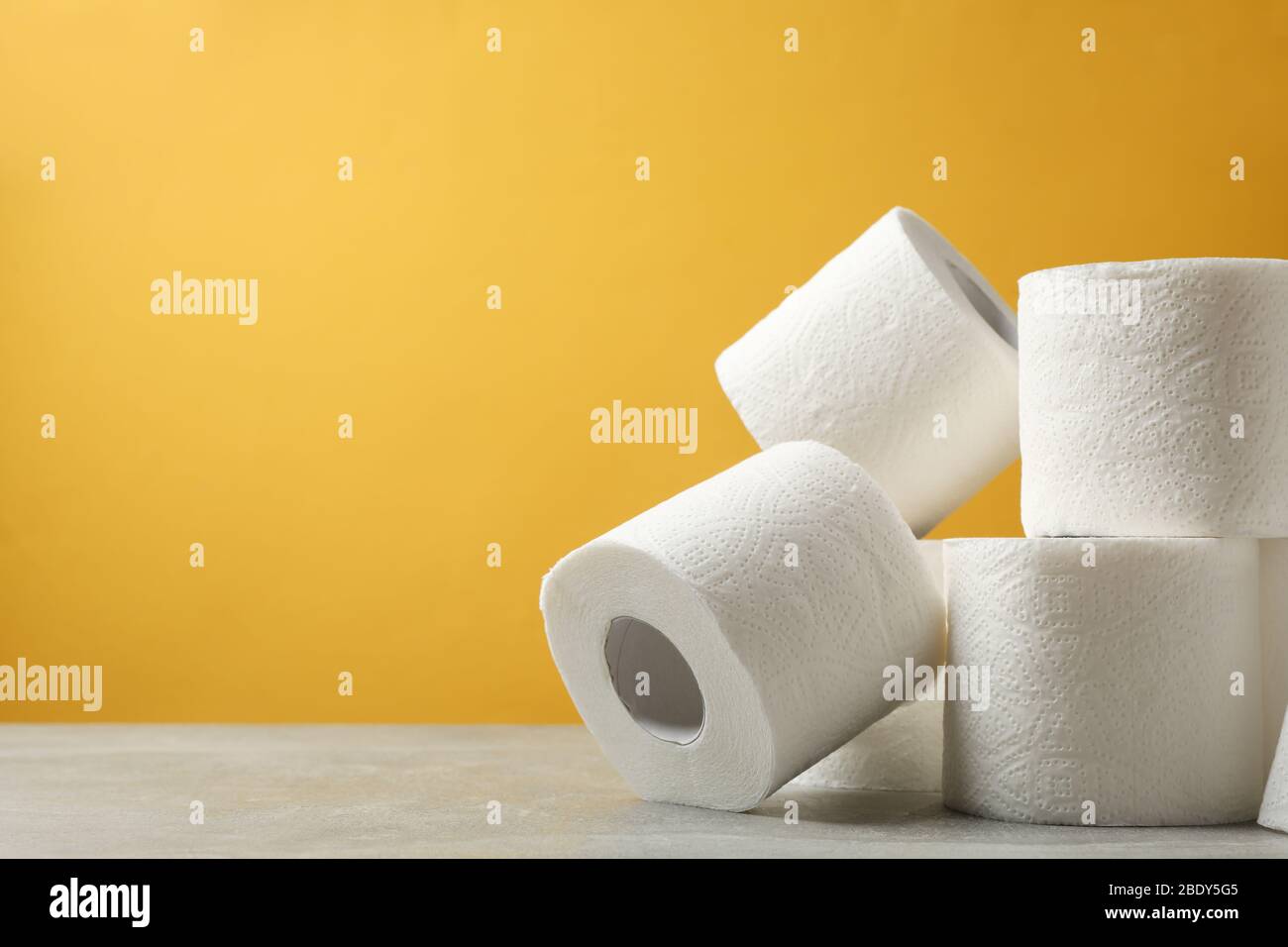 Download Toilet Paper Against Yellow Background Space For Text Stock Photo Alamy PSD Mockup Templates