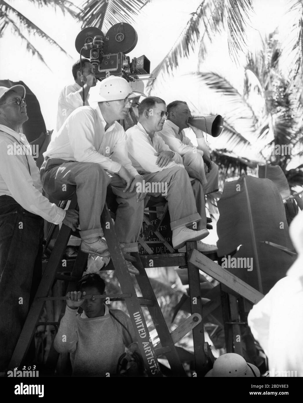 Director JOHN FORD and Camera Crew on set location candid during filming of THE HURRICANE 1937 novel Charles Nordhoff and James Norman Hall special effects James Basevi The Samuel Goldwyn Company / United Artists Stock Photo