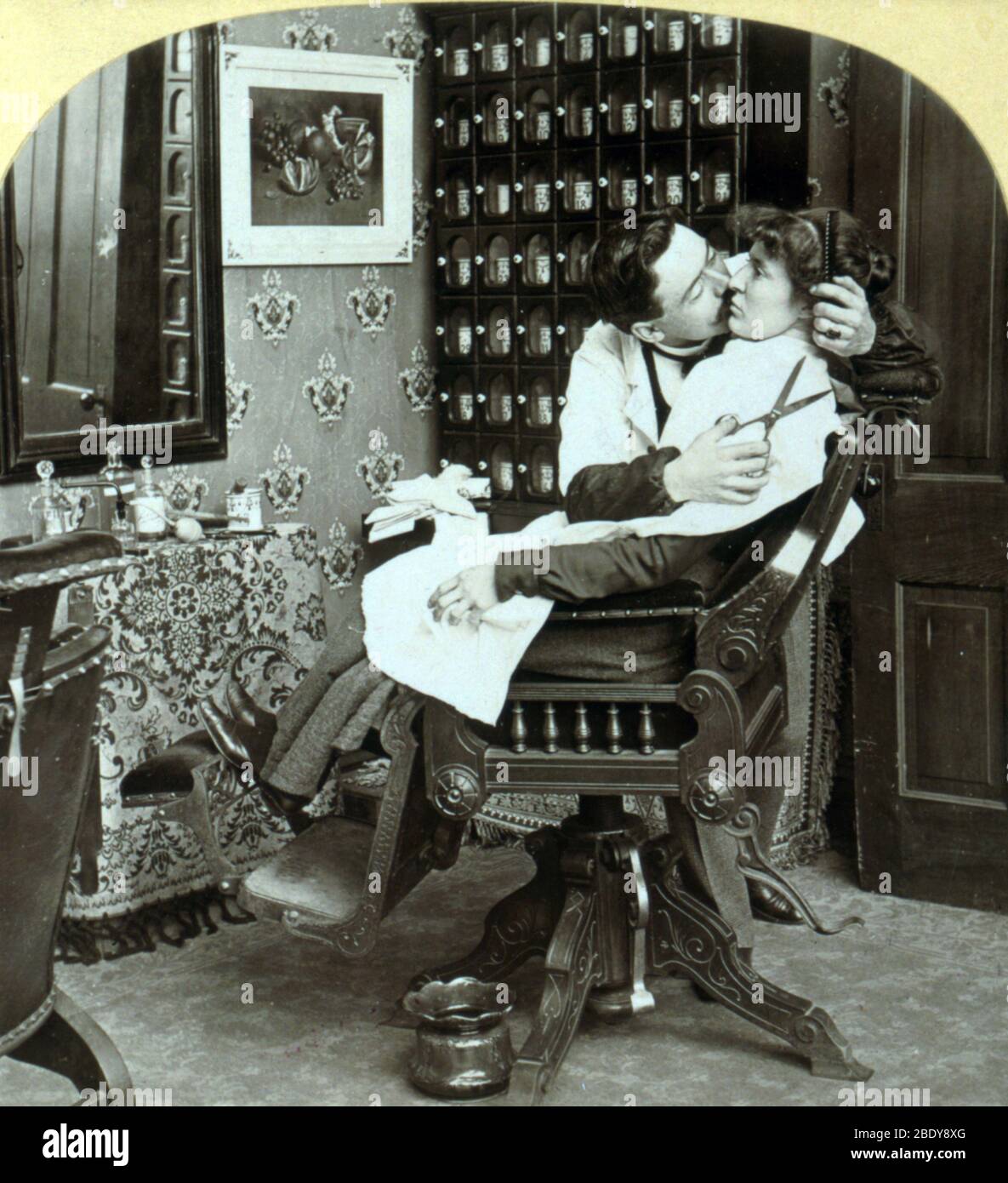 "Getting Her Hair Banged", 1900 Stock Photo