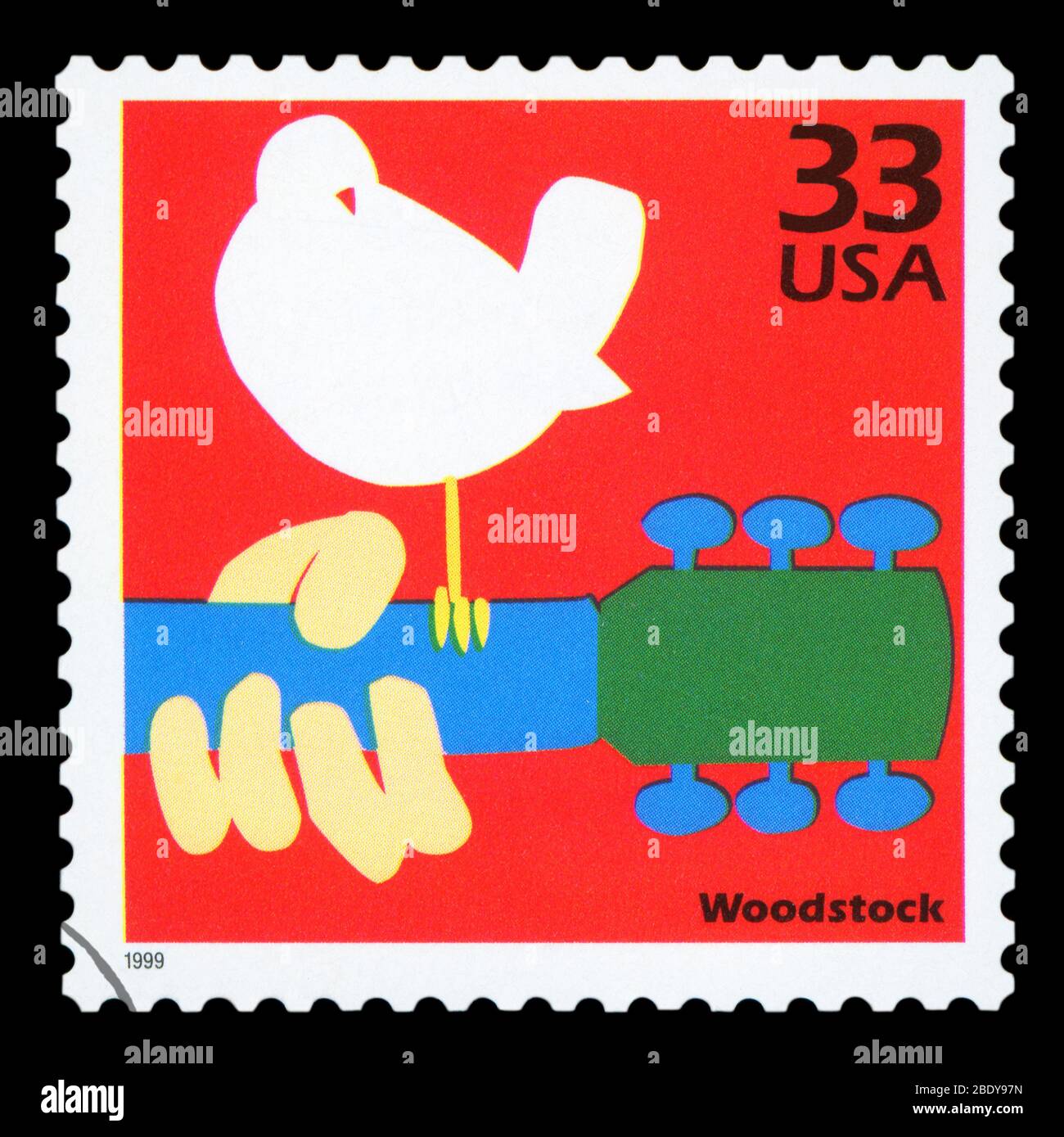 UNITED STATES OF AMERICA - CIRCA 1999: Stamp printed in USA dedicated to celebrate the century 1960s, shows Woodstock, circa 1999. Stock Photo