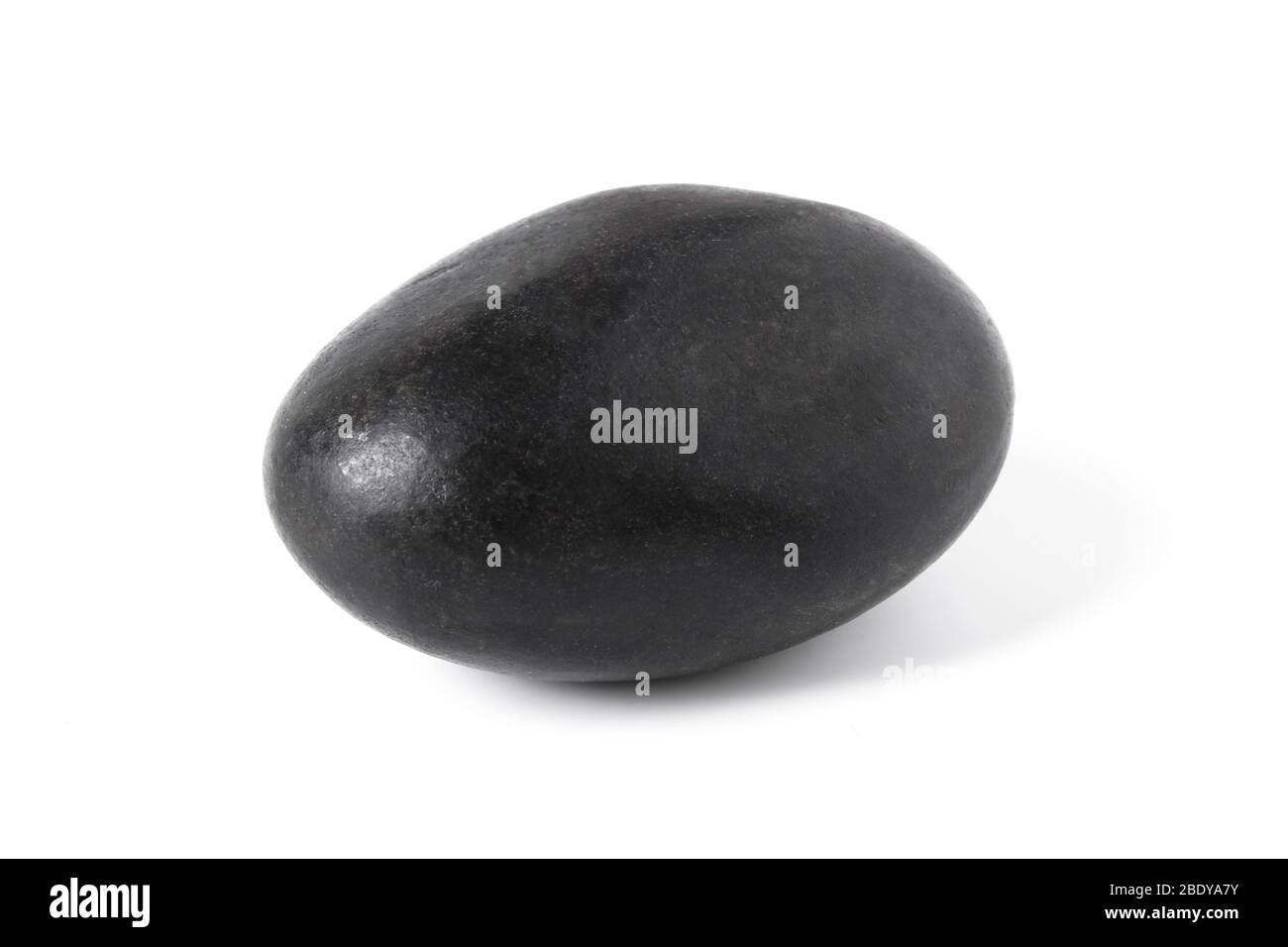 Black smooth stone close up isolated on white Stock Photo
