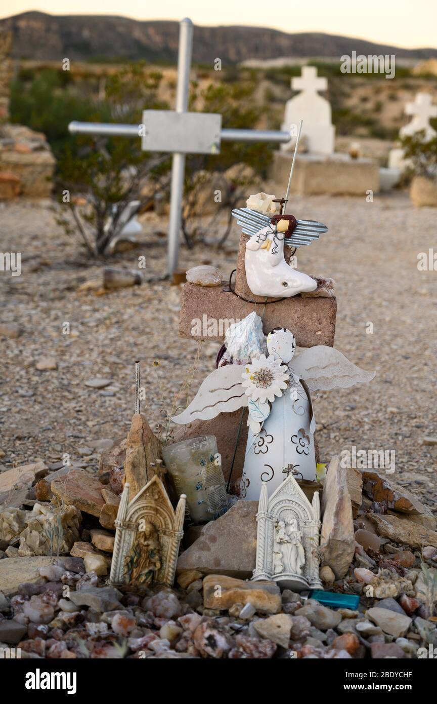 This grave features angels in the Terlingua Cemetery in West Texas, where the graves are marked by handmade embellishments. Stock Photo