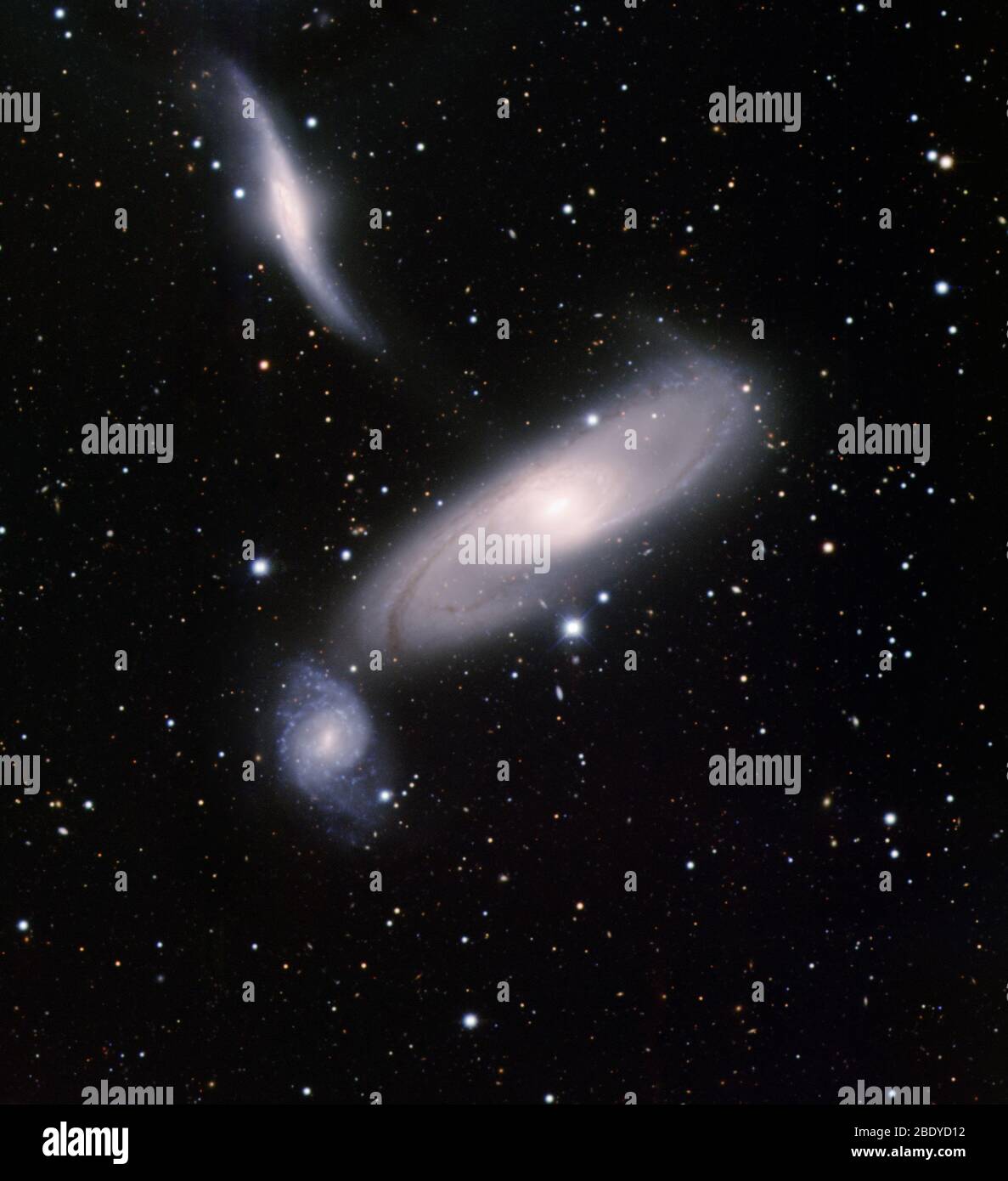 Arp 286, Interacting Spiral Galaxies Stock Photo