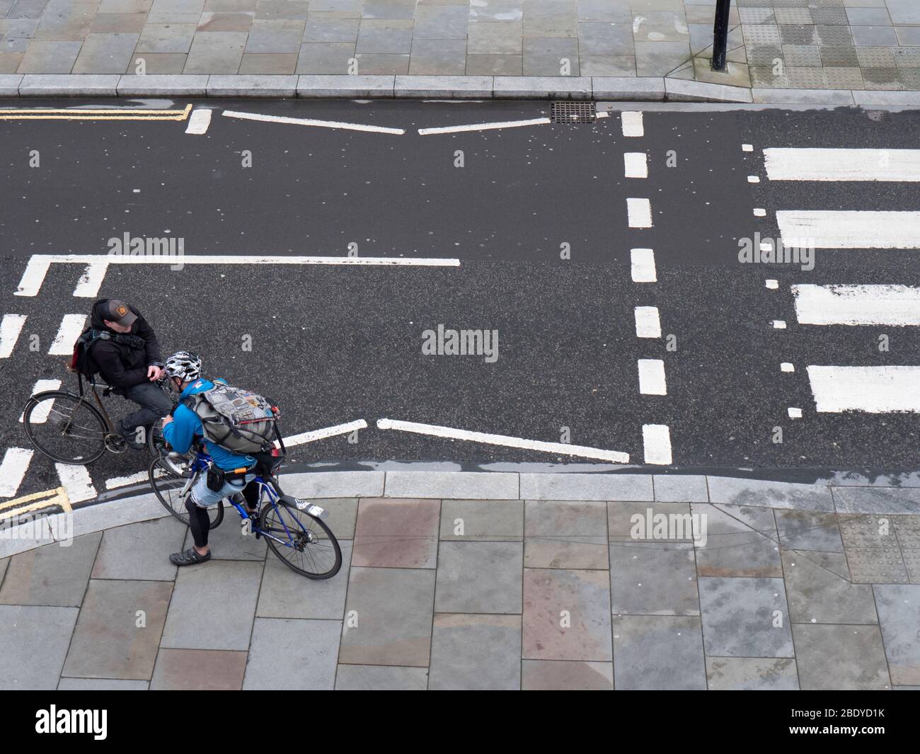 Bicycle, cycle messengers in Central London, talking at a road junction