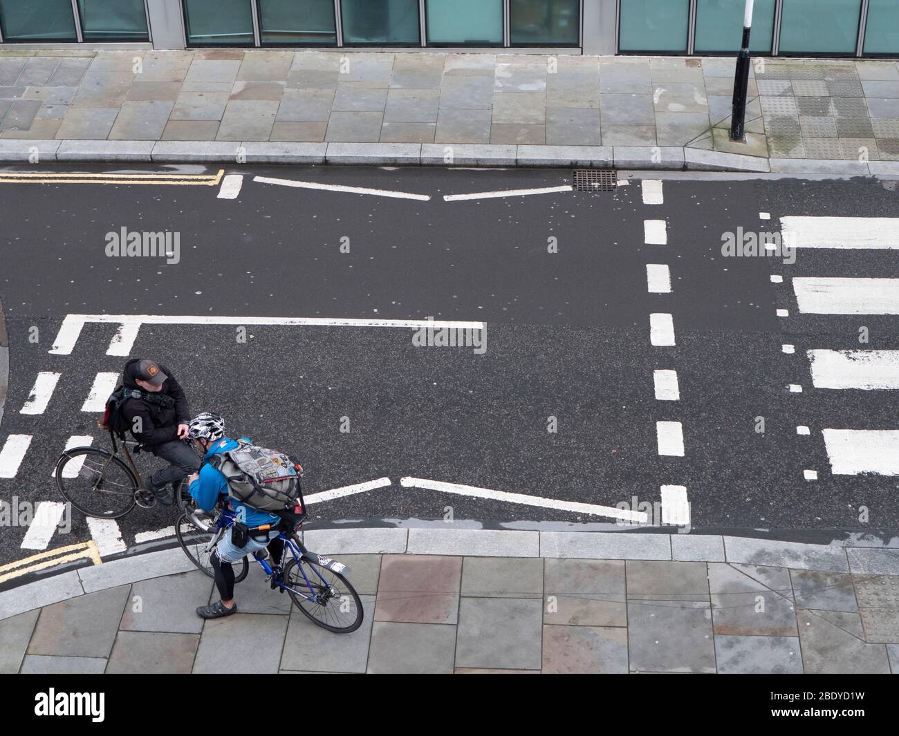 Bicycle, cycle messengers in Central London, talking at a road junction