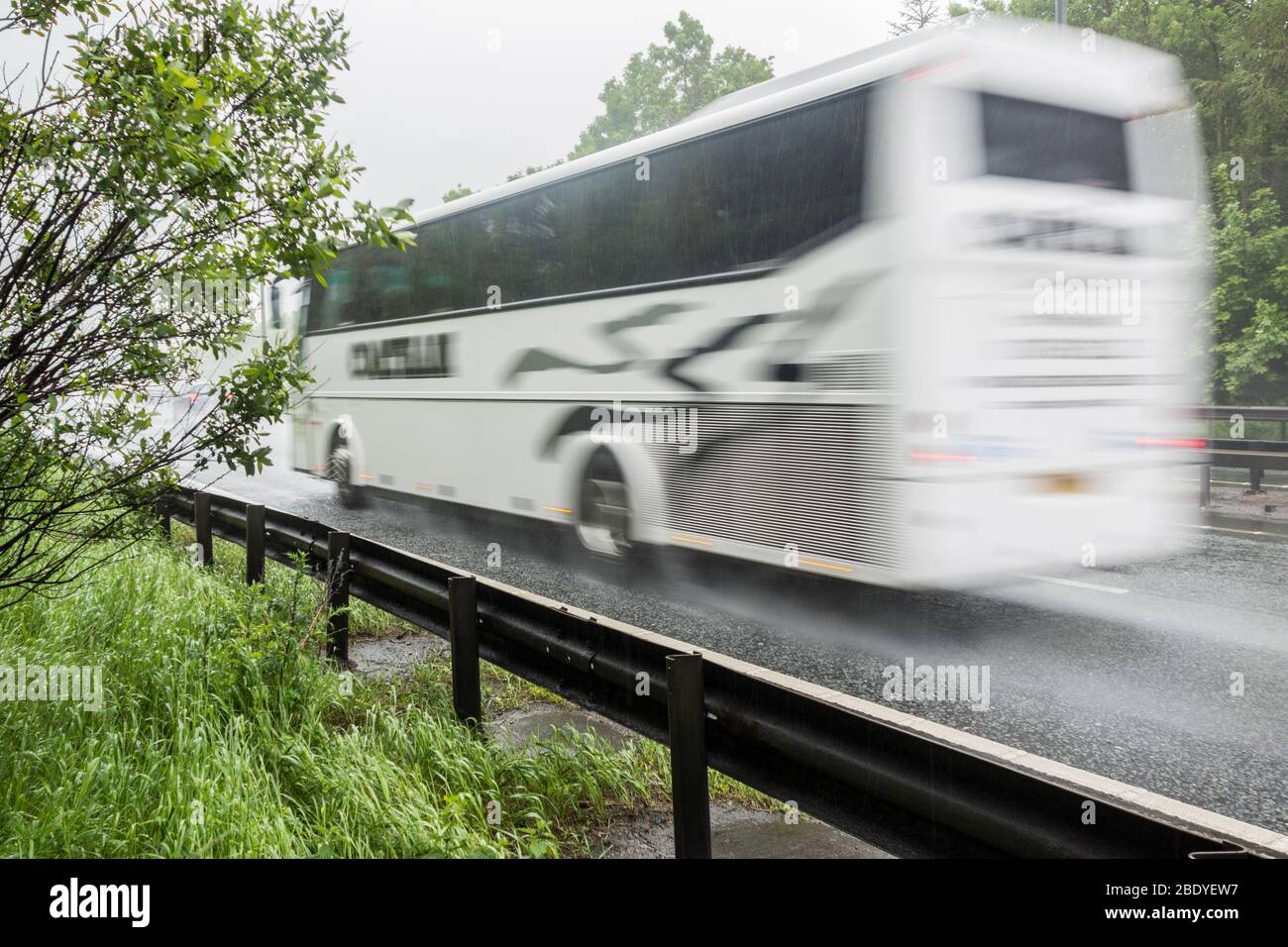 Coach, bus in heavy rain on A19 dual carriageway, north east England. UK Stock Photo