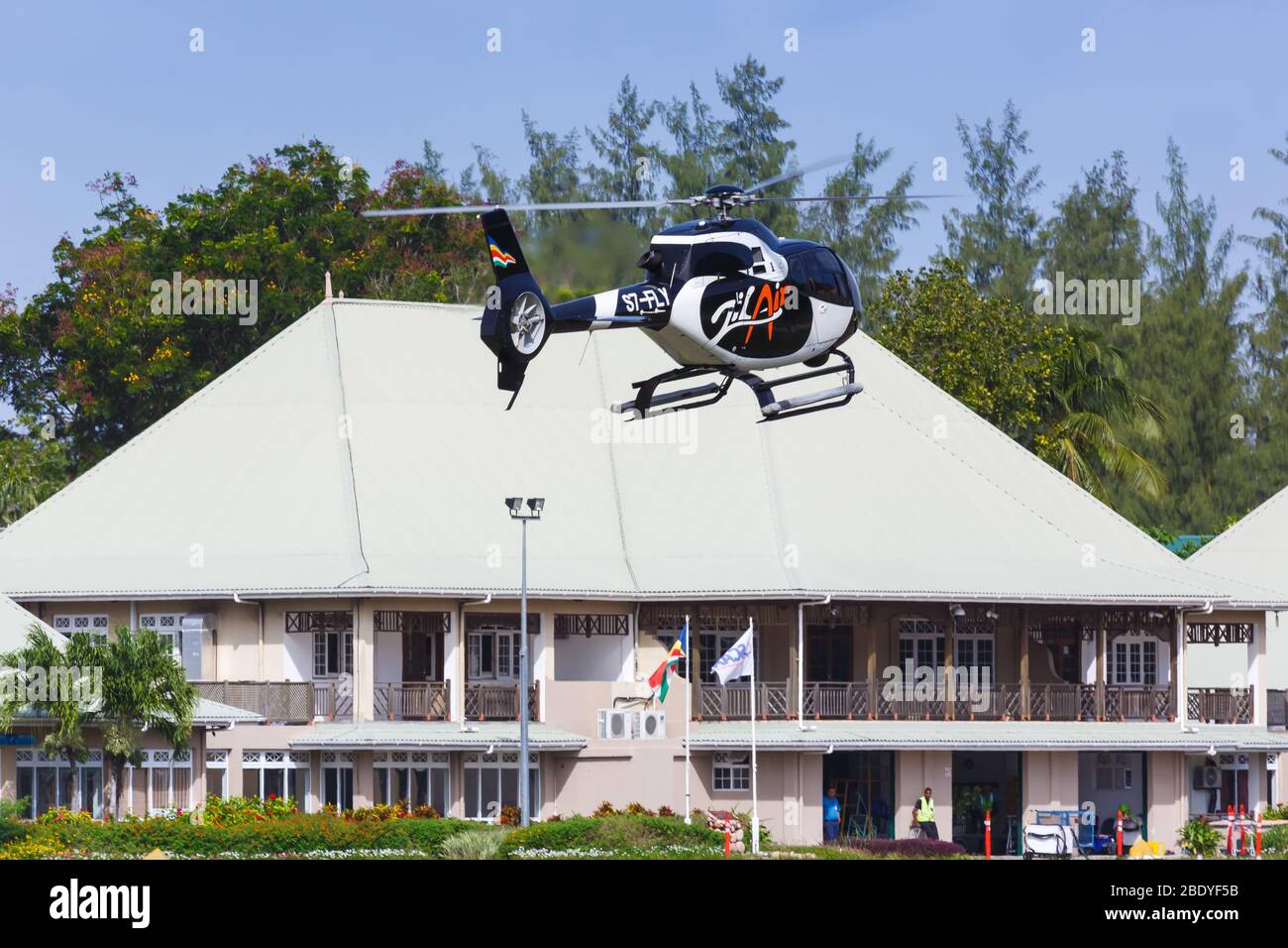 Praslin, Seychelles – February 7, 2020: Zil Air Airbus H120 helicopter at Praslin airport (PRI) in the Seychelles. Stock Photo