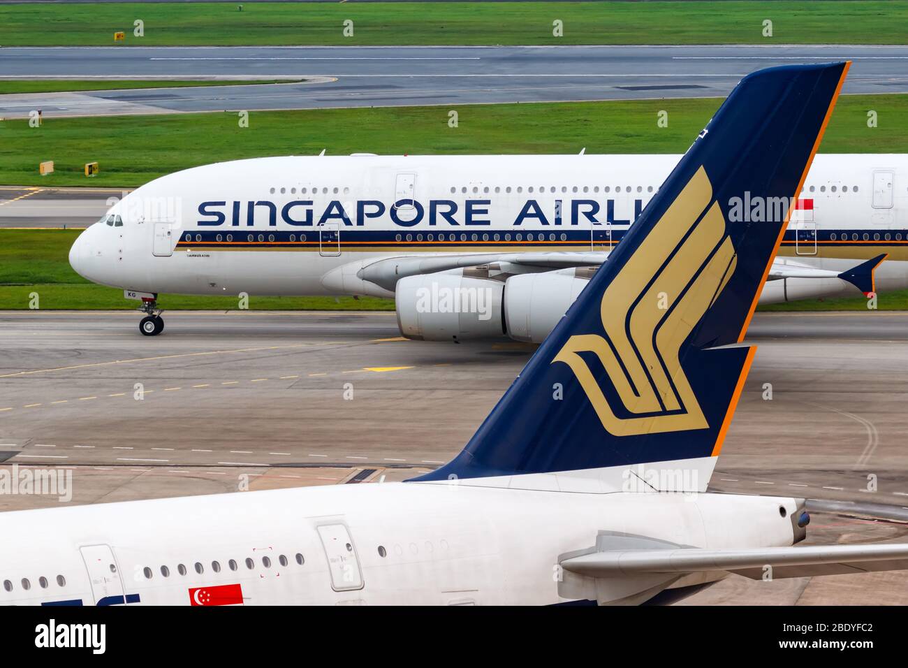 Changi, Singapore – January 29, 2018: Singapore Airlines Airbus A380 airplanes at Changi airport (SIN) in Singapore. Airbus is a European aircraft man Stock Photo