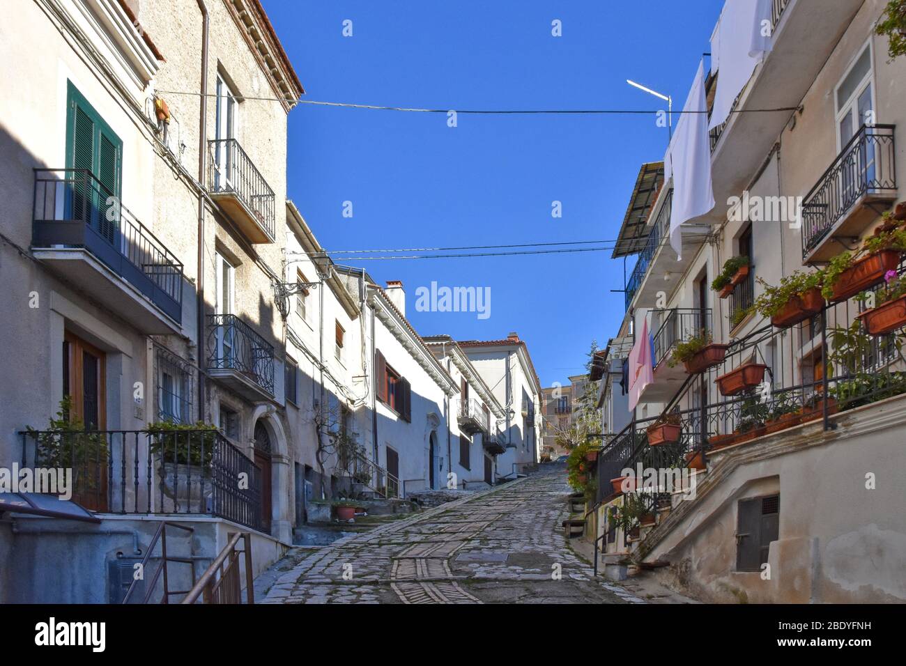 A narrow street between the houses of Padula, a town in the province of