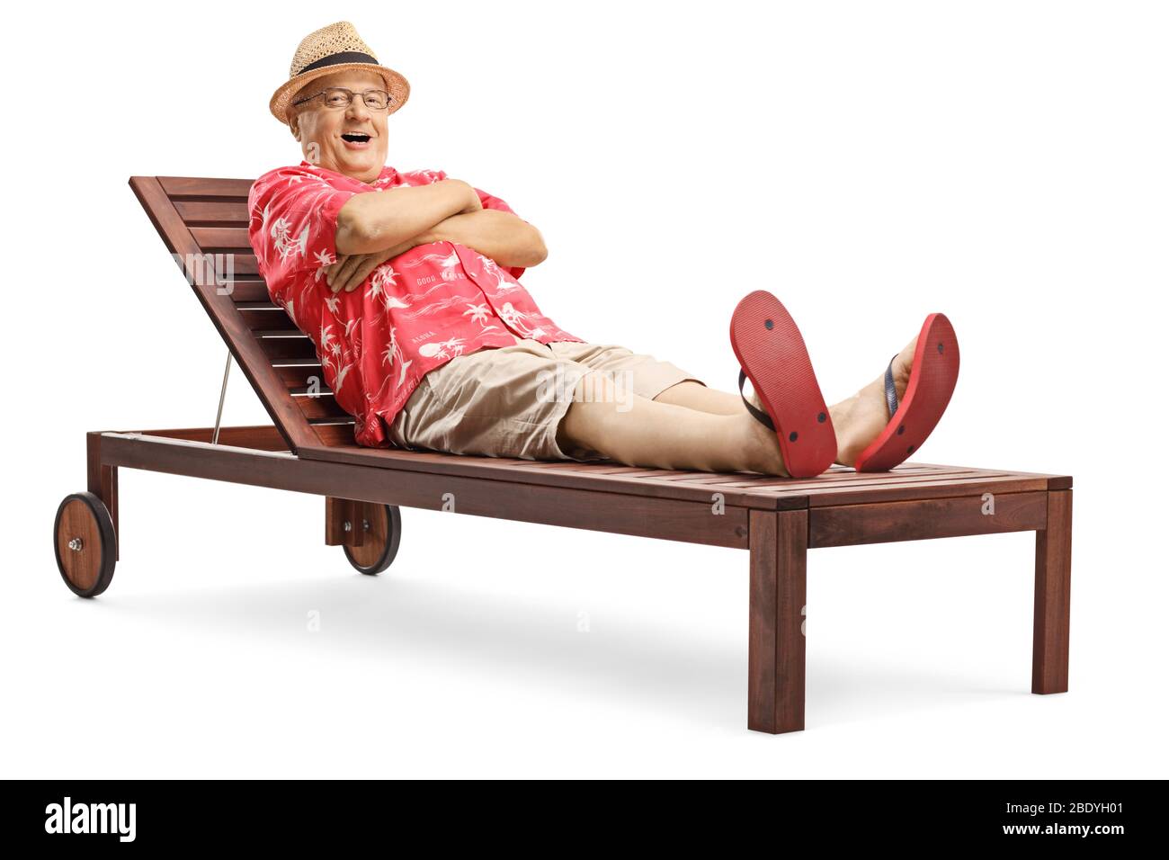 Elderly man lying on a wooden sunbed isolated on white background Stock Photo