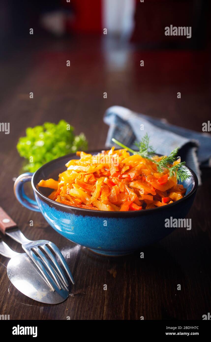 Cabbage stew with carrot in tomato sauce traditional dish of Russian
