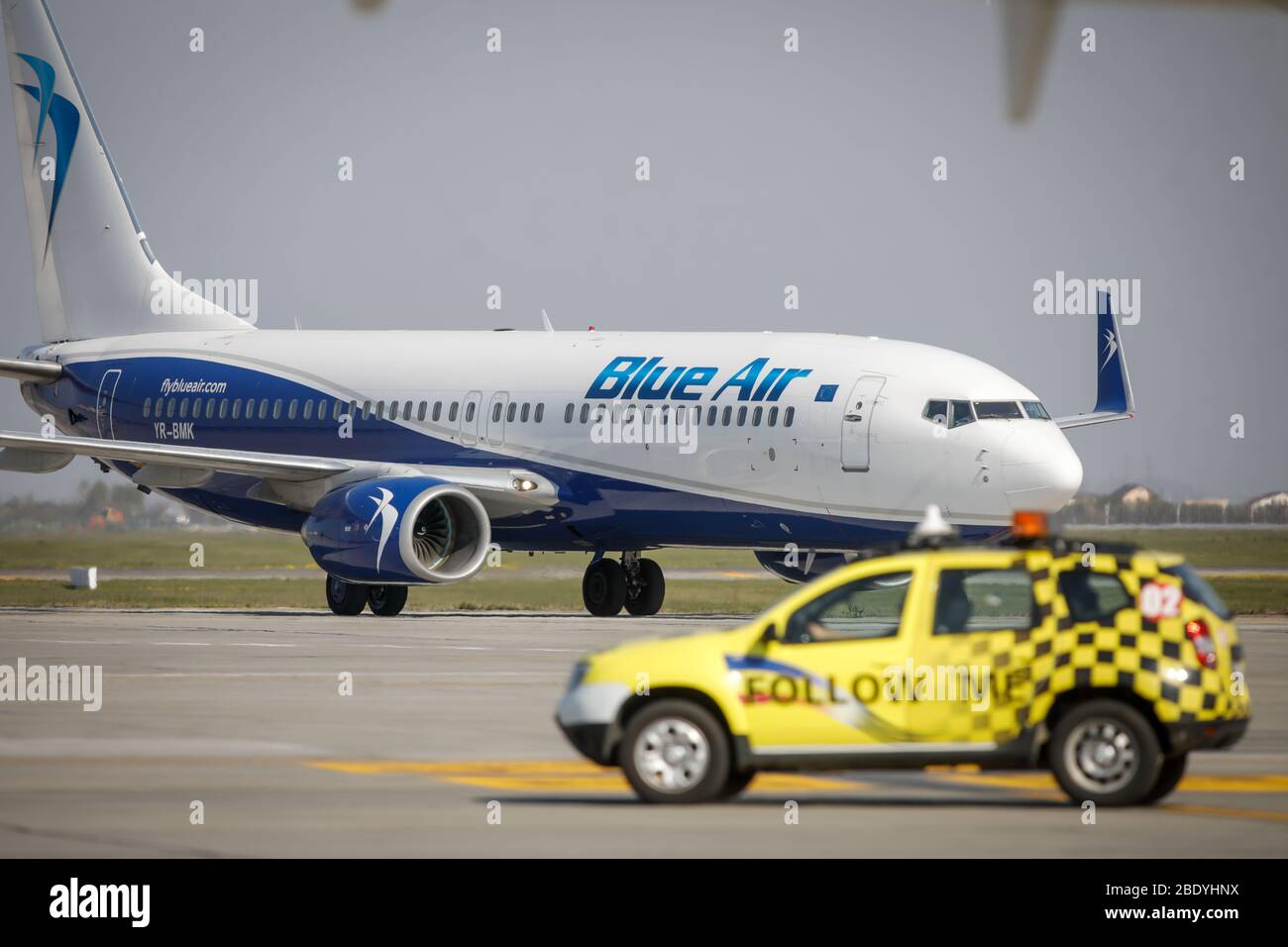 Otopeni, Romania - April 9, 2020: Blue Air airplane on Henri Coanda International Airport. Stock Photo
