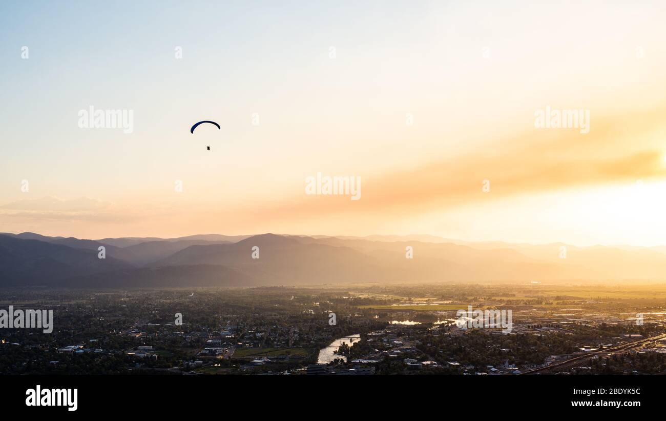 Paraglider enjoying the beautiful sunset in Missoula MT, May 2018. Stock Photo
