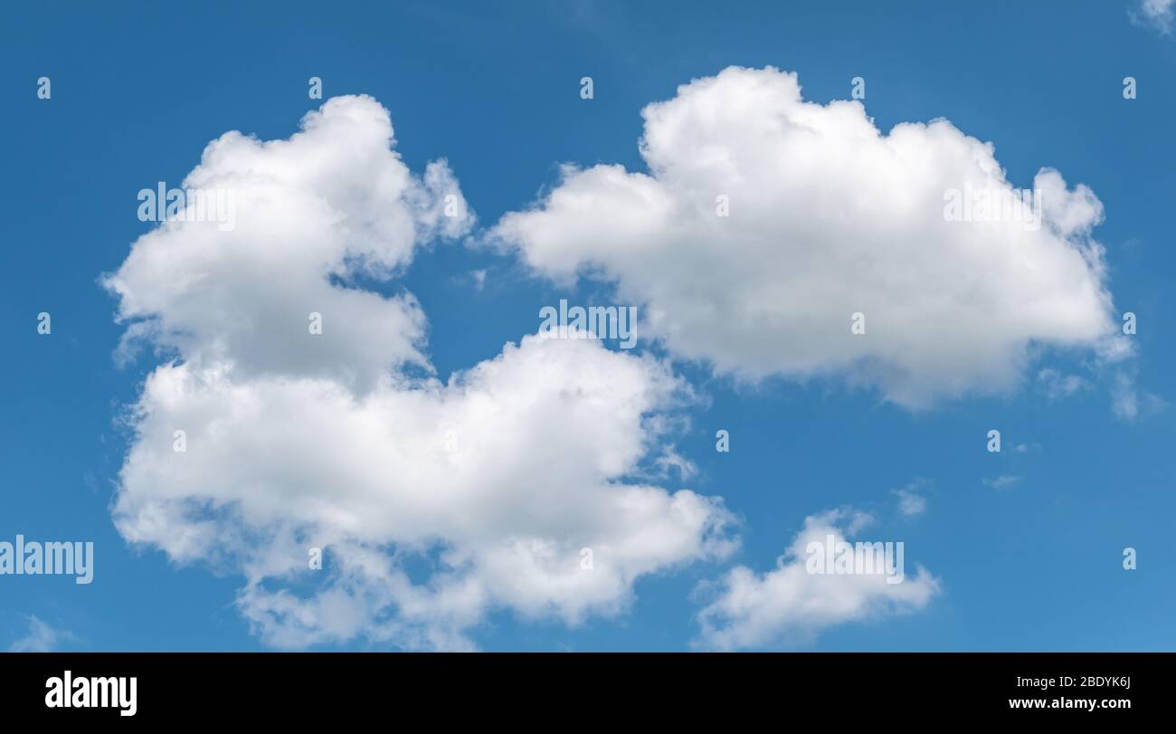 White clouds in the blue sky. Stock Photo
