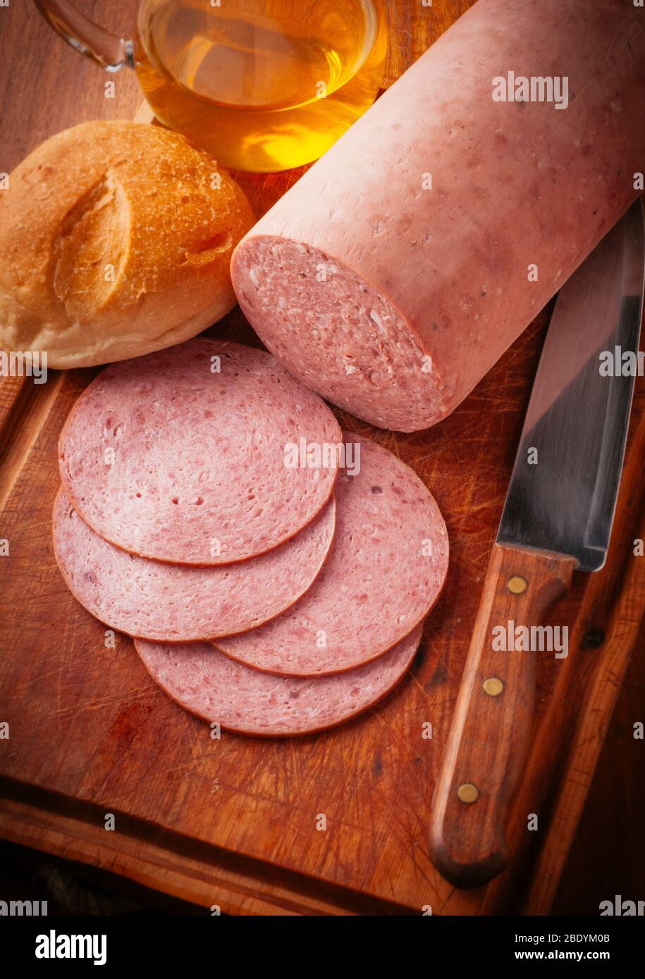 tasty piece of bologna cold cut with freshly cut fetas Stock Photo Alamy