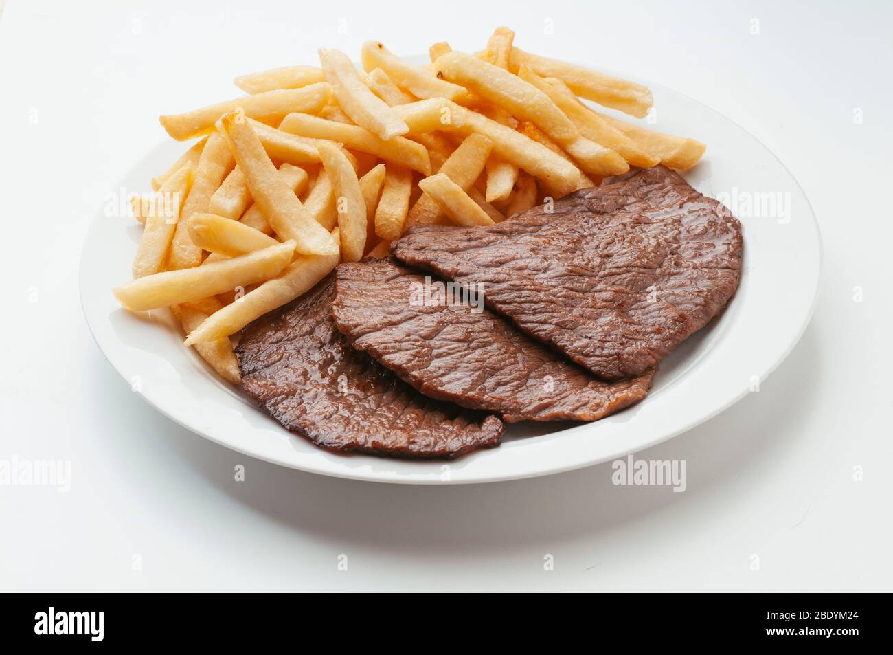 delicious grilled meat with french fries Stock Photo