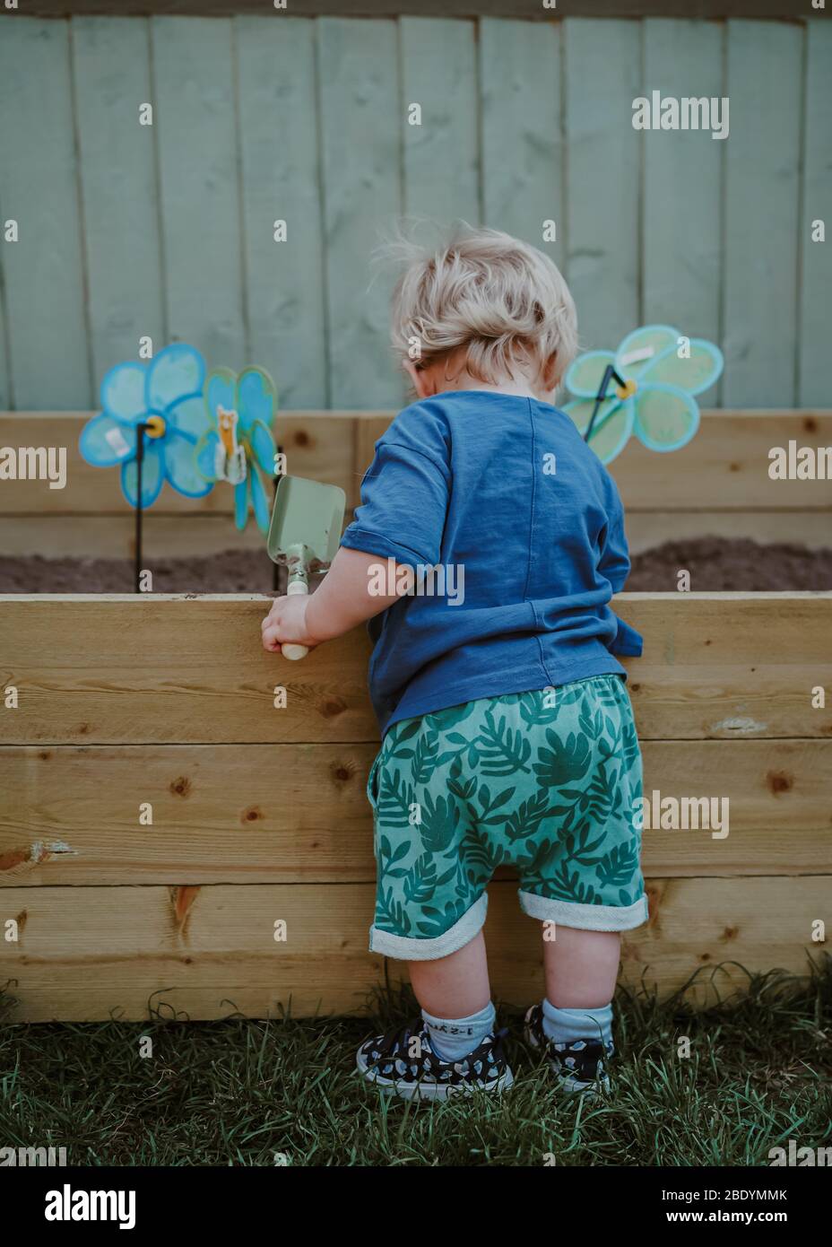 Little boy toddler gardening Stock Photo