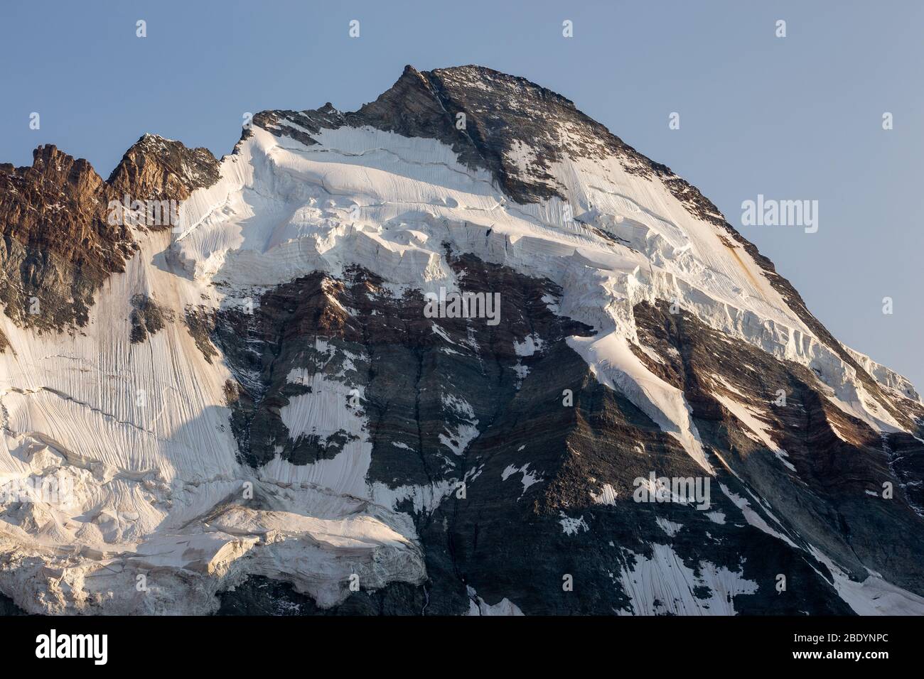 Dent d'Hérens mountain peak, north side with glaciers. Mountain wall, seracs. Swiss Alps. Europe. Stock Photo