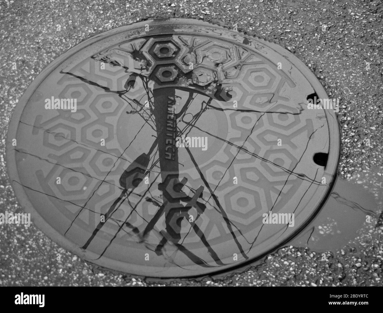 Close-up of wet manhole, Chicago, Illinois, USA Stock Photo