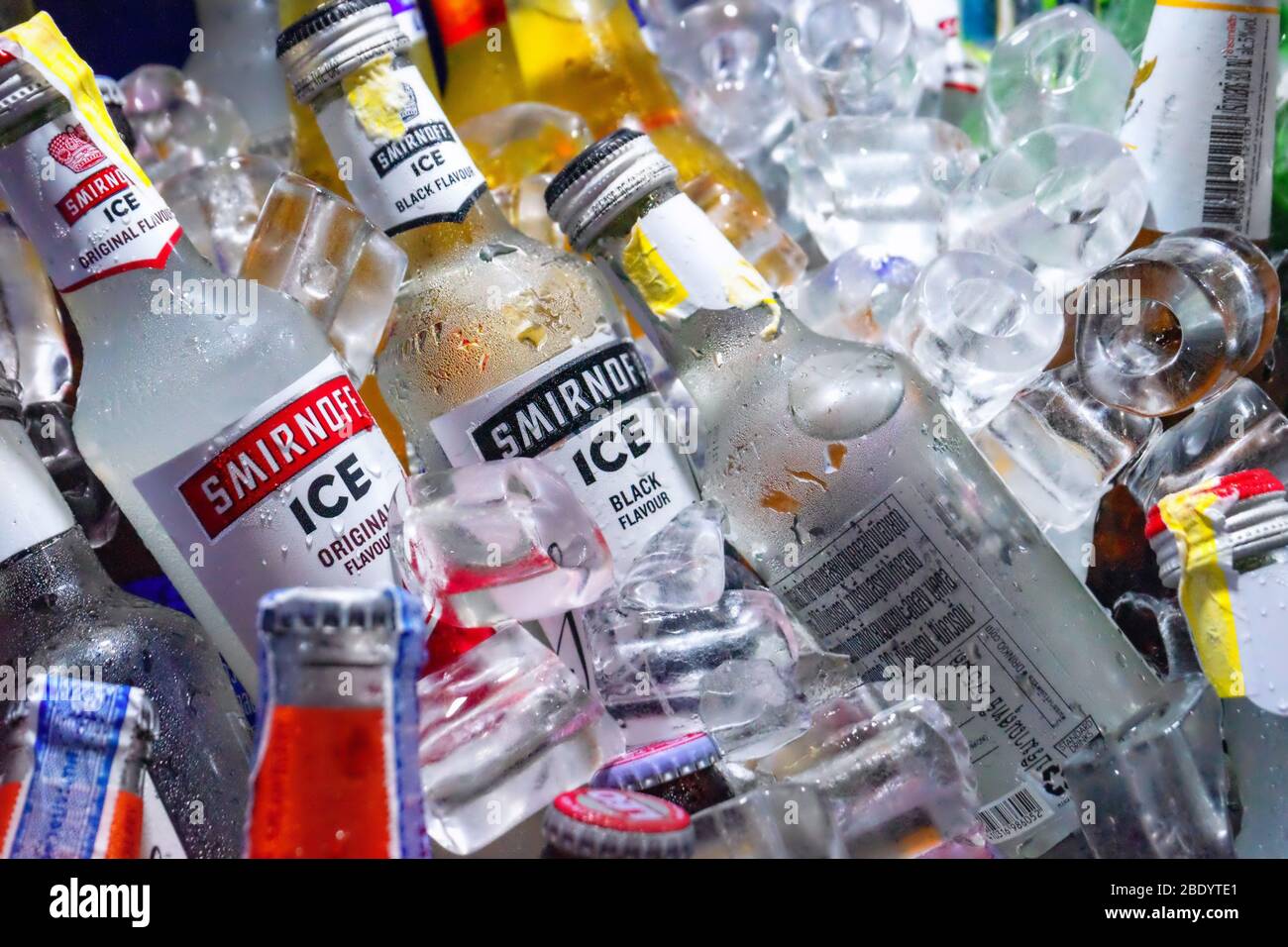 Bottles with alcohol chilled in ice cubes. Thailand, Bangkok, 2020-01-26 Stock Photo